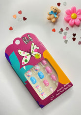 Children False Nails With Various Pink, White and Blue Patterns.